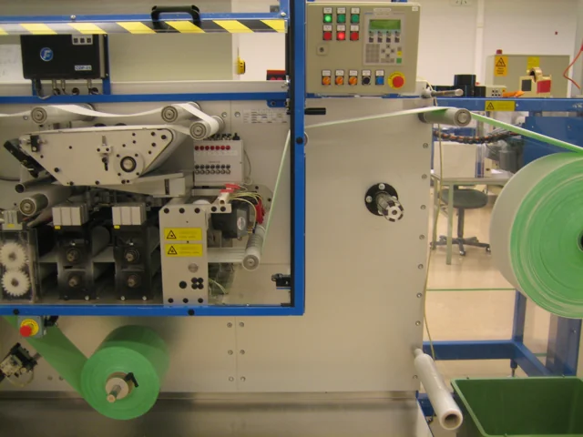 Web material running through a multi-station industrial machine