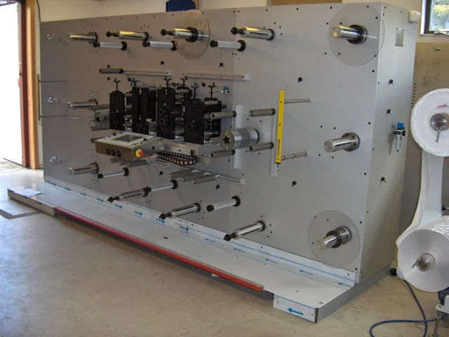 Industrial machine assembly with precision rollers and web-handling components