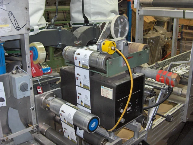 Close-up of an industrial drive and roll-to-roll process assembly